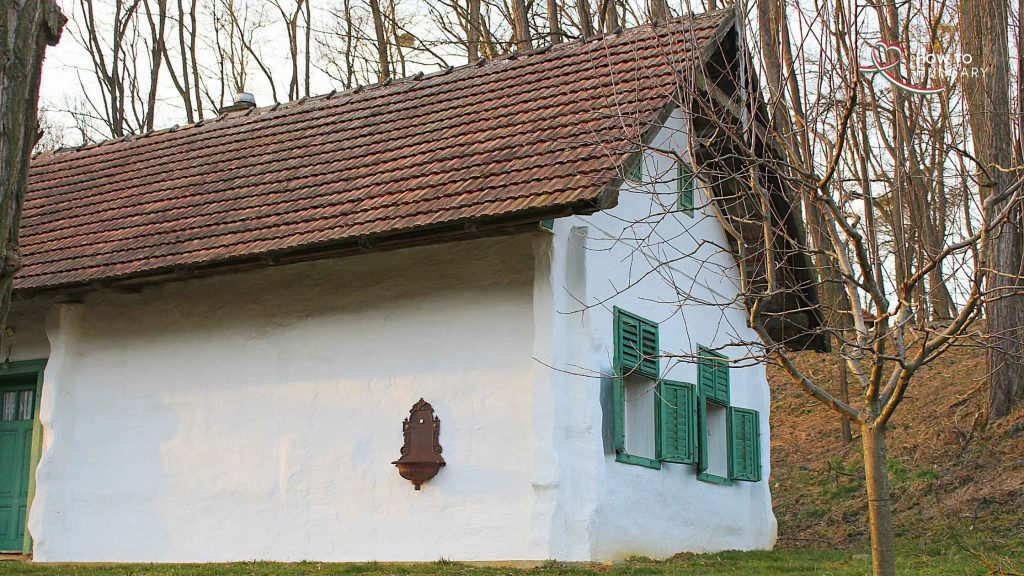 Press house in the Balaton Highlands with green shutters in spring
