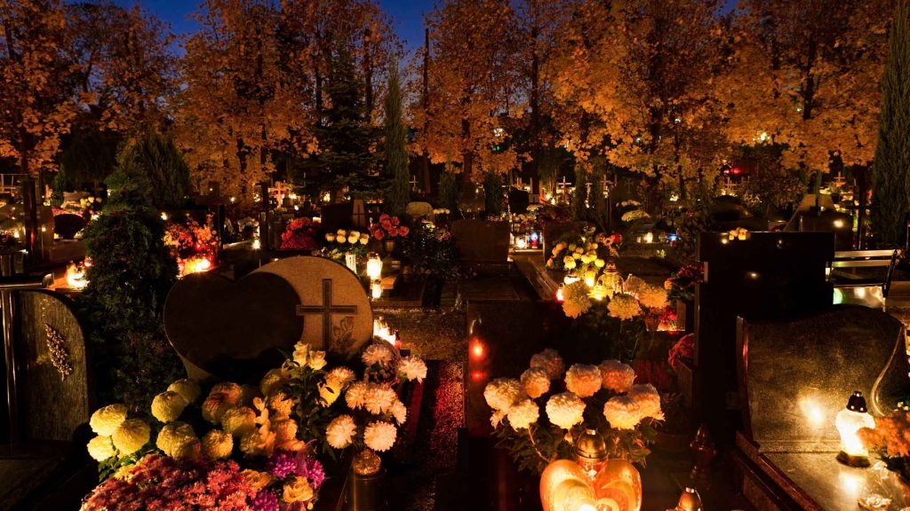 Candlelit graves in Hungary on All Saints’ Day.