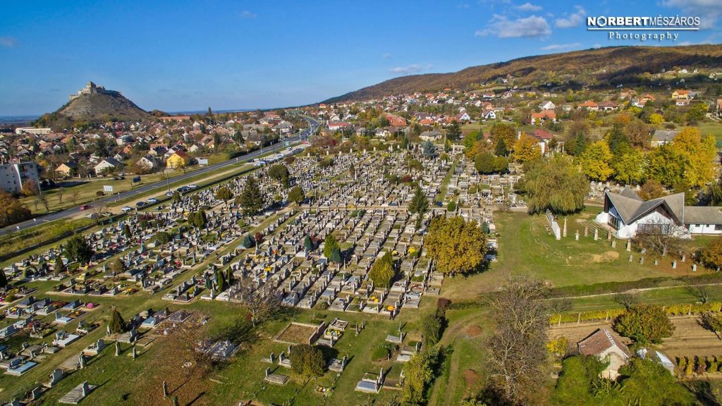 Aerial view of Sümeg Cemetery and the castle hill surrounded by autumn colours in western Hungary. Photo © Norbert Mészáros Photography.