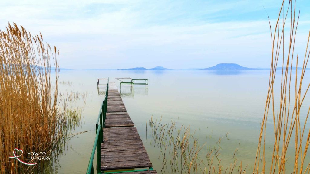 Wooden pier on Lake Balaton in early spring symbolising life in Hungary beyond official address registration.