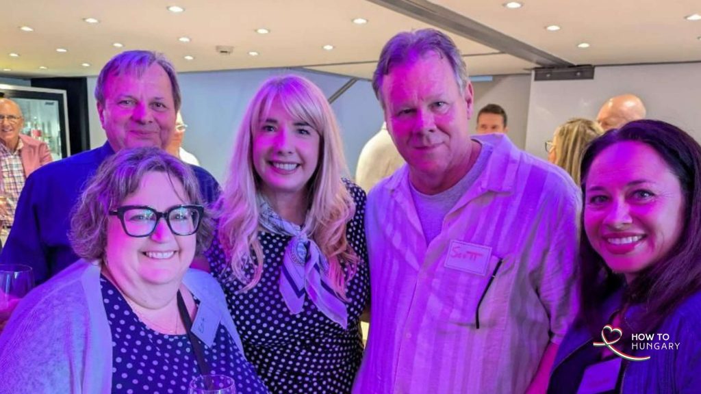  Guests smiling together with glasses of wine at the HOW TO HUNGARY Spring Social, KLUSTER
